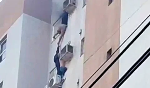 Mulher se pendura em ar-condicionado para escapar de incêndio em prédio no Paraná